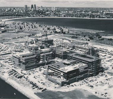 UMass Boston under construction: An aerial view of the UMass Boston campus under construction. The old Columbia Point housing development is visible just to the north of the campus. Image courtesy UMass Boston